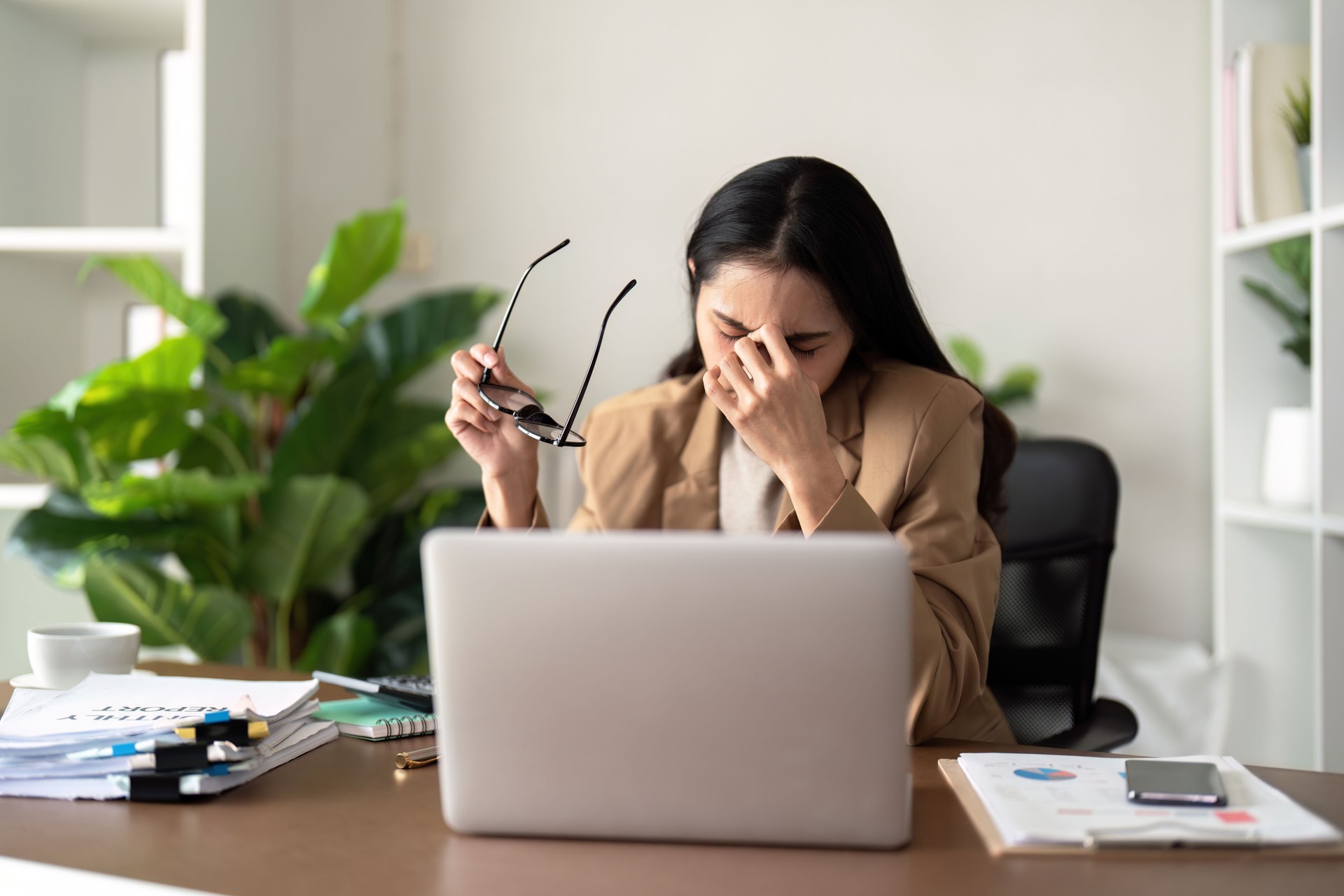 Eco friendly, businesswoman young asian stress in working on laptop while sitting at home office Eco friendly, businesswoman young asian stress in working on laptop while sitting at home office